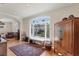 Living area with hardwood floors, a window bench, and natural light at 6405 Gulf Dr, Holmes Beach, FL 34217