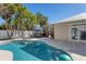 Relaxing pool area with patio and lush landscaping at 6405 Gulf Dr, Holmes Beach, FL 34217