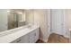 Bathroom featuring a white vanity with double sinks, framed mirrors and a glass-enclosed shower at 660 Ravello Blvd, Nokomis, FL 34275
