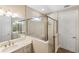 Bright bathroom features white vanity, double sinks, framed mirror and shower with a glass enclosure at 660 Ravello Blvd, Nokomis, FL 34275
