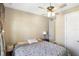 Comfortable bedroom featuring a ceiling fan, neutral walls, and a well-lit interior at 660 Ravello Blvd, Nokomis, FL 34275