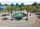 Elegant entrance fountain with palm trees at 660 Ravello Blvd, Nokomis, FL 34275