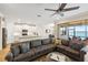 Comfortable living room with water views and open access to the modern kitchen at 660 Ravello Blvd, Nokomis, FL 34275