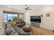 Inviting living room with water view, with comfortable seating and a stylish rug at 660 Ravello Blvd, Nokomis, FL 34275