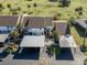 Aerial view of condo building showcasing parking and landscaping at 694 Bird Bay W Dr # 137, Venice, FL 34285