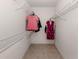 Walk-in closet with wire shelving and hanging rods at 694 Bird Bay W Dr # 137, Venice, FL 34285