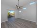 Bright bedroom with wood-look floors and access to lanai at 7236 Cedar Hollow Cir # 11-202, Bradenton, FL 34203