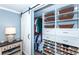 Organized closet with hanging rods and shoe storage at 735 Cumberland Rd, Venice, FL 34293