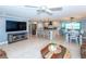 Open floor plan living room and kitchen with modern fixtures at 735 Cumberland Rd, Venice, FL 34293