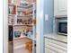 Well-organized pantry with ample shelving for storage at 735 Cumberland Rd, Venice, FL 34293