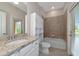 Bathroom with granite countertop and tiled shower/tub at 10185 Colubrina Dr, Venice, FL 34293