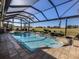 Screened pool and spa overlooking the golf course at 110 Martellago Dr, North Venice, FL 34275