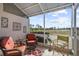 Relaxing screened porch overlooking peaceful landscape at 1119 Lynx Run, North Port, FL 34288