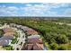 Aerial view of a single Gathering home in a residential neighborhood at 11945 Hunters Creek Rd, Venice, FL 34293