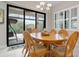 Bright dining room with sliding glass doors leading to a relaxing outdoor patio at 11945 Hunters Creek Rd, Venice, FL 34293