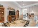 Bright and airy living room with an open floor plan and views into adjacent rooms at 11945 Hunters Creek Rd, Venice, FL 34293