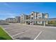 Modern apartment building with covered parking and a sunny day at 12240 Wellen Golf Street # 107, Venice, FL 34293