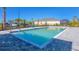 Community pool with accessibility lift and paved deck at 12280 Wellen Golf St # 104, Venice, FL 34293