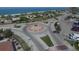 Aerial view of a roundabout near beach access and local businesses at 12329 Veronese St, North Port, FL 34287