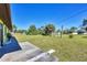 Large backyard with a grassy area and a shed at 12329 Veronese St, North Port, FL 34287