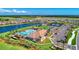 Aerial view of community pool, tennis courts, and clubhouse at 13812 Alafaya St, Venice, FL 34293