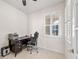 Home office with built-in desk and window shutters at 13812 Alafaya St, Venice, FL 34293