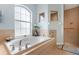 Relaxing bathroom with a large soaking tub and a walk-in shower at 150 Marker Rd, Rotonda West, FL 33947