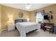 Cozy bedroom with double bed, nightstands, and a built-in desk at 150 Marker Rd, Rotonda West, FL 33947