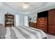 Primary bedroom with king-size bed, dresser, and bookcase at 150 Marker Rd, Rotonda West, FL 33947