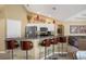 Kitchen island with a breakfast bar and four chairs at 150 Marker Rd, Rotonda West, FL 33947