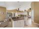 Kitchen with white cabinets, stainless steel appliances, and an island at 150 Marker Rd, Rotonda West, FL 33947