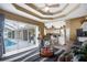 Open floor plan with kitchen, living area, and pool access at 150 Marker Rd, Rotonda West, FL 33947