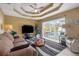 Bright living room with pool view, sliding glass doors and comfy seating at 150 Marker Rd, Rotonda West, FL 33947