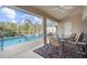 Covered patio area overlooking the refreshing pool at 150 Marker Rd, Rotonda West, FL 33947
