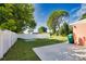 Spacious backyard featuring a patio, green space, and privacy fence at 1605 Phillip Pl, Englewood, FL 34223