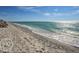 Beachfront view with clear water and sandy shore at 1605 Phillip Pl, Englewood, FL 34223
