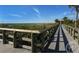 Wooden boardwalk leads to the beach at 1605 Phillip Pl, Englewood, FL 34223