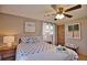 Bright bedroom featuring ceiling fan, nautical decor, and wood flooring at 1605 Phillip Pl, Englewood, FL 34223
