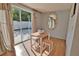 Bright dining space with a table and chairs, and a view to the backyard at 1605 Phillip Pl, Englewood, FL 34223
