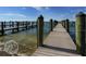 Long wooden dock extending into the water at 1605 Phillip Pl, Englewood, FL 34223