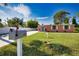 Quaint Florida house with a manicured lawn and a mailbox at 1605 Phillip Pl, Englewood, FL 34223