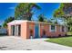 Orange house with blue door and decorative accents at 1605 Phillip Pl, Englewood, FL 34223