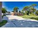Well-maintained single story home with a driveway and a lush lawn at 1605 Phillip Pl, Englewood, FL 34223