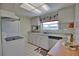 Clean kitchen featuring granite countertops and stainless steel appliances at 1605 Phillip Pl, Englewood, FL 34223