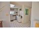 Kitchen with granite countertops, stainless steel appliances, and white cabinets at 1605 Phillip Pl, Englewood, FL 34223