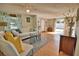 Open living room with white couch, blue coffee table, and access to other rooms at 1605 Phillip Pl, Englewood, FL 34223