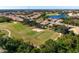 House on golf course community with a lake in the background at 1767 San Silvestro Dr, Venice, FL 34285