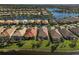 Aerial view showcasing a house nestled in a community by the water at 19303 Jacinda St, Venice, FL 34293