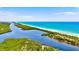 Aerial view of waterfront property with lush greenery at 19303 Jacinda St, Venice, FL 34293