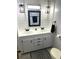 Modern bathroom with double vanity and updated fixtures at 218 Trailorama Dr, North Port, FL 34287